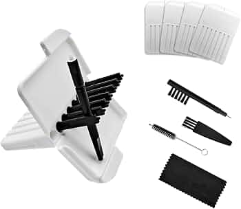 Hearing aid maintenance kit featuring black cleaning tools, white storage cases, and a microfiber cloth.